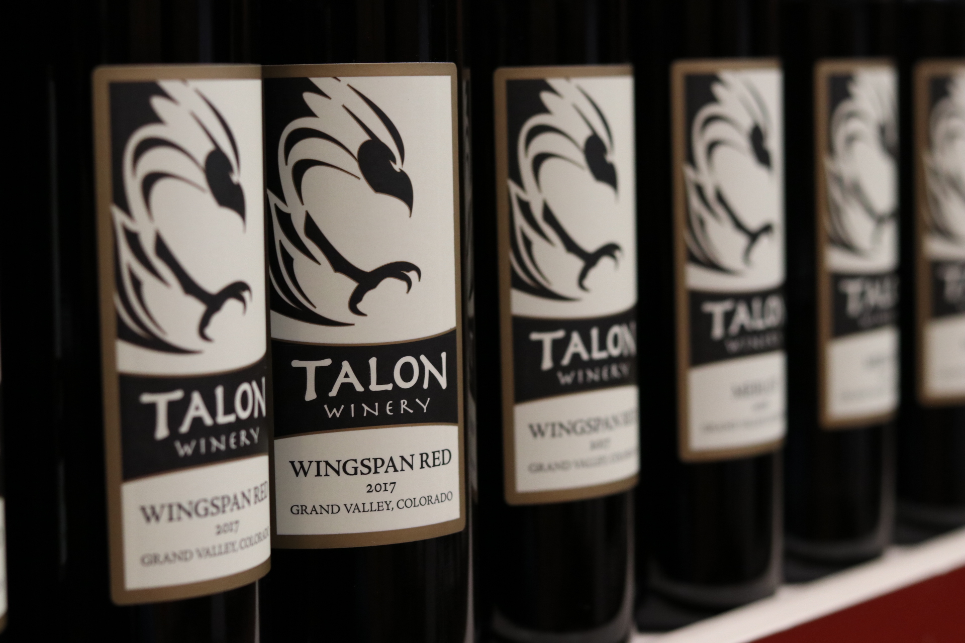 Bottles of Talon Wingspan Red lined up on a shelf