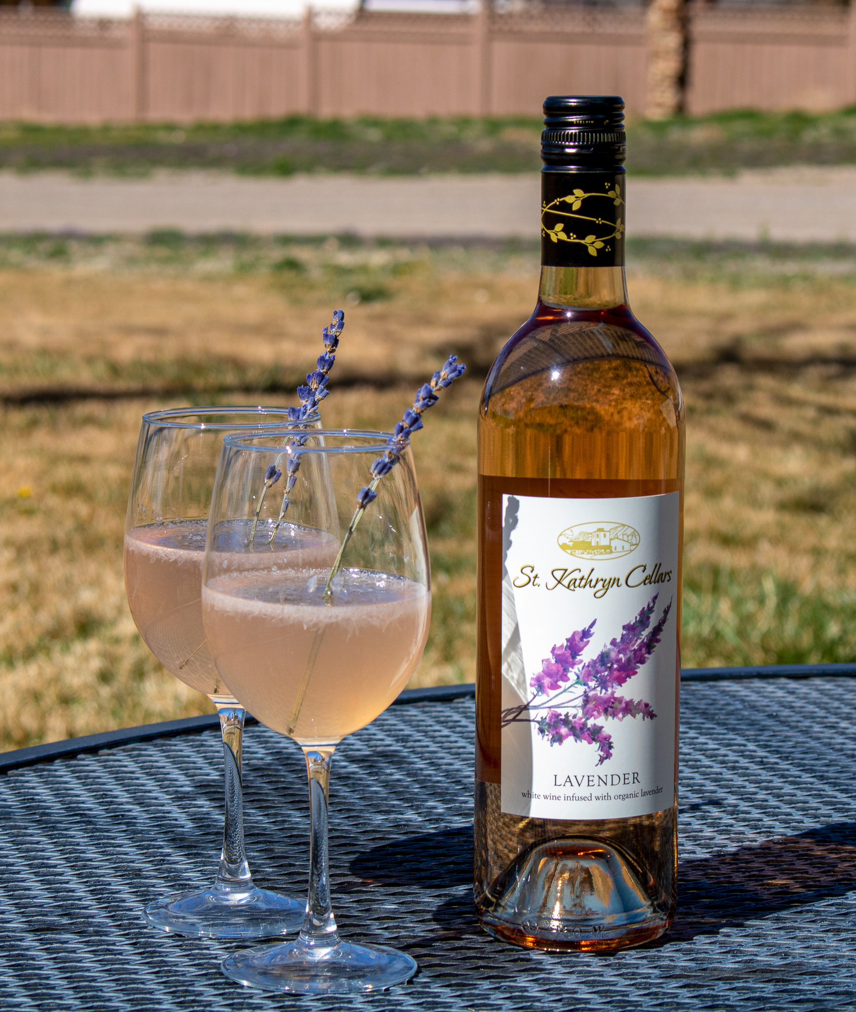 lavender lemonade drink with bottle of Lavender wine
